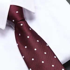 Wine red polka dot tie detail shot, exquisite herringbone texture for business formal wear.