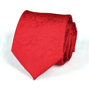 Close-up of a stylish red jacquard woven business necktie showing fabric details.