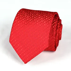 Detail view of a classic red geometric textured business wedding necktie for men and formal wear.