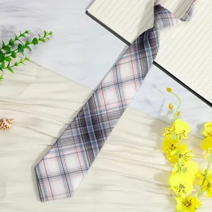 Detail view of a Japanese style pink and blue plaid pre-tied JK uniform necktie.