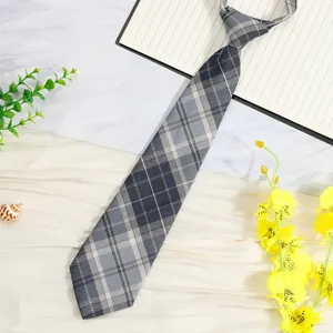 Close up view of a grey plaid JK tie, featuring a pre-tied design for easy daily wear.