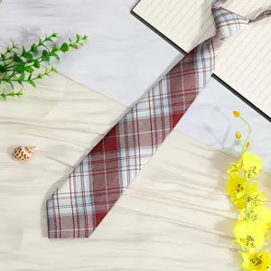 Detailed view of a Japanese pre-tied plaid JK tie accessory, showcasing fabric texture.