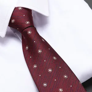 Red men necktie formal business wedding tie with white dot pattern fabric closeup view.