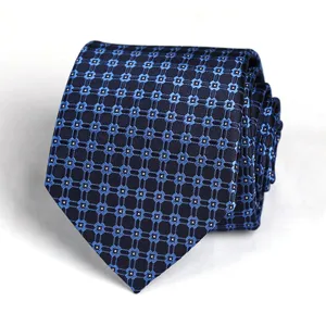 Blue geometric pattern tie for men, stylish necktie for business and formal wear.