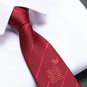 Close-up detail of a red wedding tie with double happiness embroidery and zipper design.