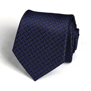 Detailed shot of a stylish blue and black geometric patterned mens business dress necktie.
