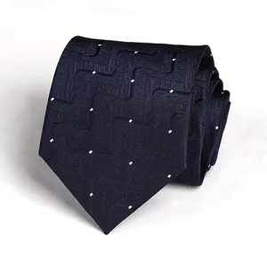 Dark blue geometric patterned necktie detail view for professional business wear.