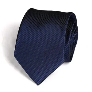 Detailed view of dark blue striped necktie, premium texture and fine diagonal weave design.