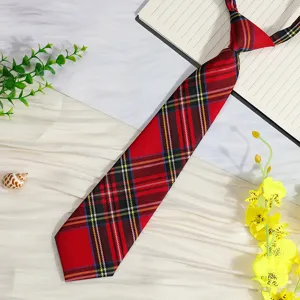 Detailed view of red plaid JK tie, featuring pre-tied design and classic academy pattern.