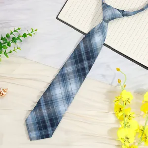 Detail view of a blue plaid preppy JK necktie, stylish student uniform accessory.