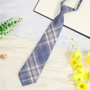 Blue plaid JK tie detail view showing fabric texture and neat pre-tied knot design.