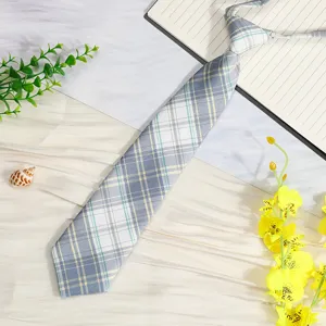 Detailed shot of a Japanese style blue plaid JK uniform necktie with pre-tied design.