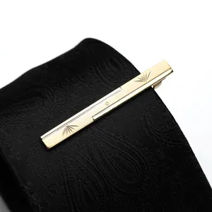 Gold metal tie clip detail view for men business formal wear suit accessory piece