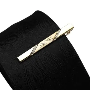 Mens gold tie clip classic business metal tie bar elegant engraved design for formal wear.