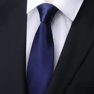 Detailed close-up of a classic navy blue men's business tie paired with a white dress shirt.
