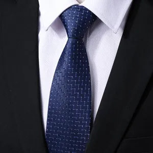 Close-up detail of a blue business formal men's tie with geometric woven pattern.