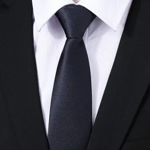 Close-up detail of a classic dark blue twill men's business necktie fabric texture.