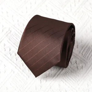 Detailed view of the dark brown striped men's necktie closeup texture fabric display.