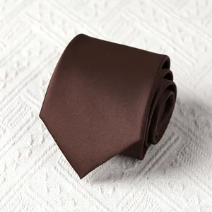 Brown silk tie detail shot, exquisite rolled design, premium formal wear accessory.