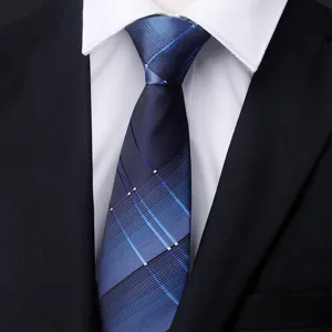 Close-up view of the blue plaid men's business necktie fabric texture and knot detail.