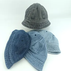 Close-up detail view of casual children's washed denim bucket hats in multiple colors.