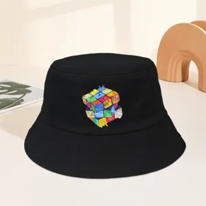 Detail view of black bucket hat featuring colorful creative Rubik cube graphic print.
