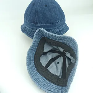 Close-up detail view of kids denim bucket hat, showing inner lining and premium wash fabric.