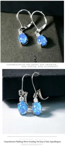 Boucles d'oreilles pendantes argentées en zircone opale bleue bijoux élégants femme.