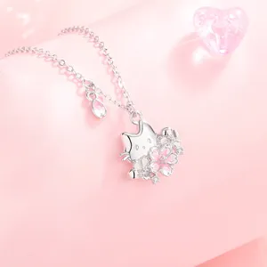 Detailed close-up of the cute silver cat and cherry blossom pendant necklace, sweet design.
