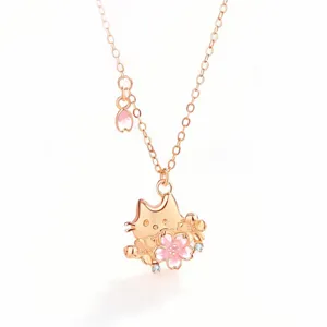 Exquisite cherry blossom cat necklace detail shot, featuring rose gold finish and delicate crystals.