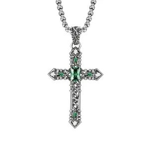 Detailed view of vintage gothic cross pendant necklace with green crystal and silver rope chain.