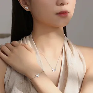 Stunning detail view of the exquisite mother-of-pearl butterfly necklace and matching set.