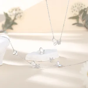 Elegant butterfly jewelry set featuring mother of pearl and shimmering zircon crystals.