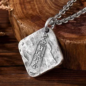 Detailed close-up shot of retro vintage Thai silver square pendant necklace texture display.
