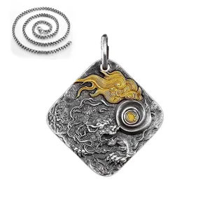 Close-up detail of the retro Thai silver dragon pendant with auspicious cloud reliefs and chains.