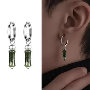 Silver hoop earrings with green cylindrical stone drop pendants, stylish daily wear jewelry.
