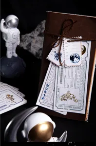 Vintage space theme sticky note book with creative astronaut ticket design paper for journaling.