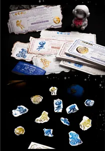 Vintage space ticket memo pad set with gold foil astronaut designs for journaling and crafts.