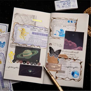 Vintage gold-stamped ticket memo pads and space universe aesthetic stationery material papers.