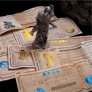 Retro bronzing ticket memo pad material paper set with astronaut figurine for journaling.