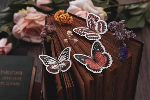 Exquisite 3D butterfly bookmarks featuring vintage book page clips and floral aesthetic decor.