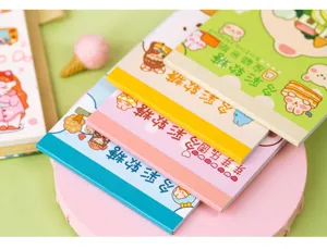 Detailed close-up of pastel sticker books with cute cartoon designs and colorful covers.