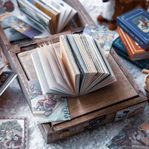 Notes adhésives de mini-livres de Noël vintage et matériel de collage pour carnet de notes.