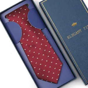 Burgundy silk necktie with white whale pattern, neatly packed in an elegant blue gift box.