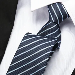 Close-up detail of a classic navy blue striped tie featuring light blue diagonal lines.