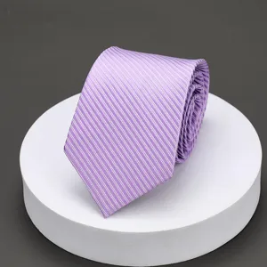 Purple striped tie detail view, elegant textured fabric for formal business wear and suits.