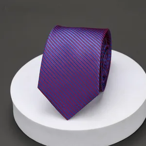 Close-up detail of the classic blue and red striped business tie fabric texture.