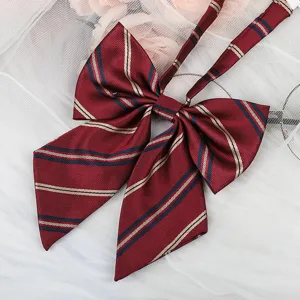 Detailed shot of dark red striped JK bow tie ribbon, featuring classic diagonal stripes.