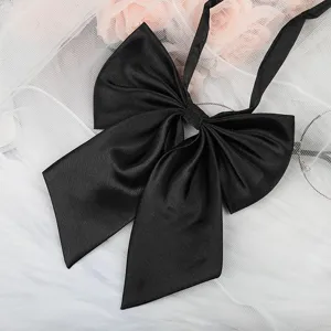 Black JK uniform bow tie accessory, elegant satin ribbon detail for sweet sailor shirt styling.