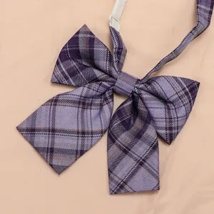 Detailed view of the purple plaid JK bow tie fabric texture and classic pre-tied bow design.